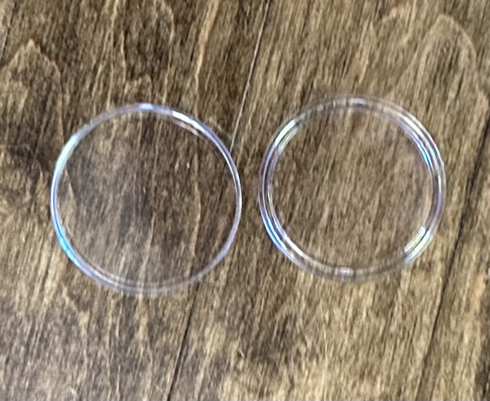 Coins in protective capsules and holders.